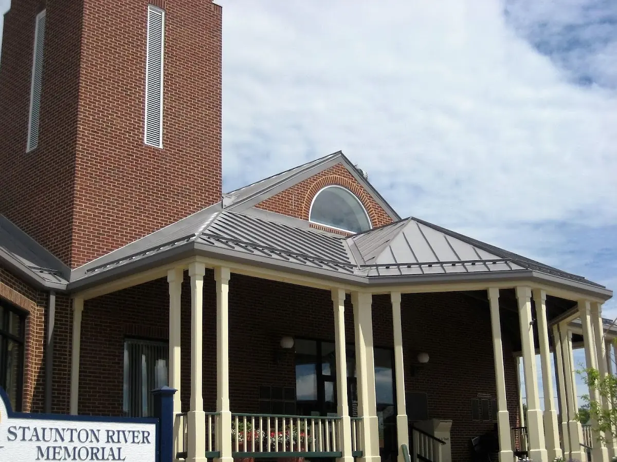 Skilled roofing craftsmen working on a residential roof in Siler City